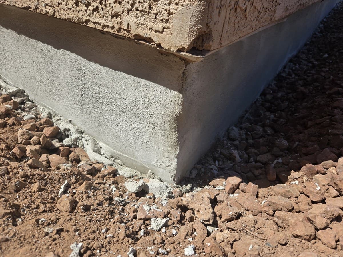 Foundation slab corner finished with high-strength repair mortar troweled smooth